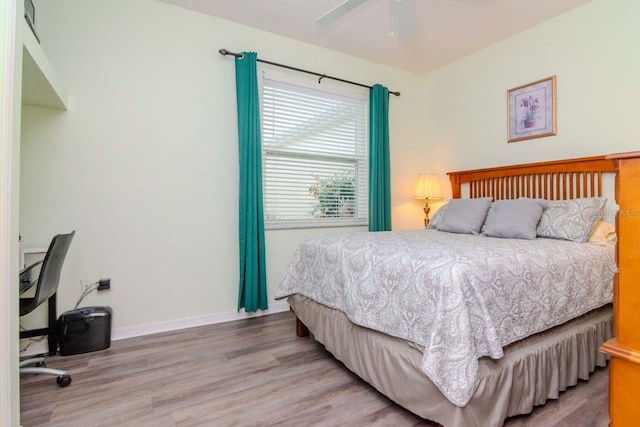 bedroom featuring ceiling fan and light hardwood / wood-style floors