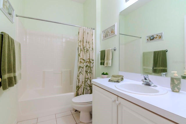 full bathroom with tile patterned floors, vanity, toilet, and shower / bath combo with shower curtain