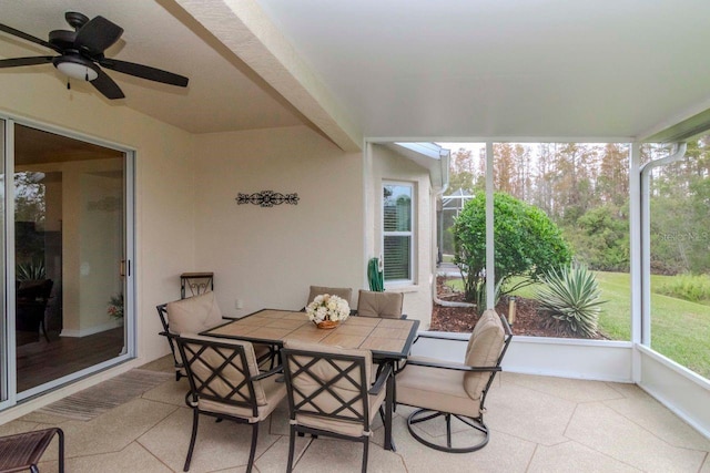 sunroom featuring ceiling fan