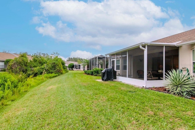 view of yard featuring a sunroom