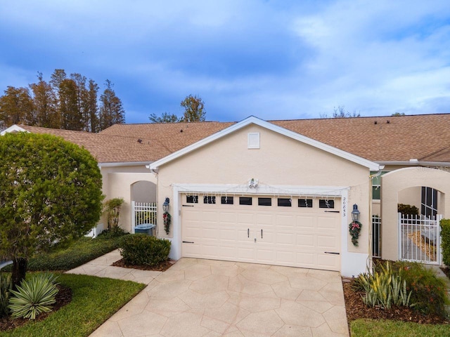 single story home featuring a garage