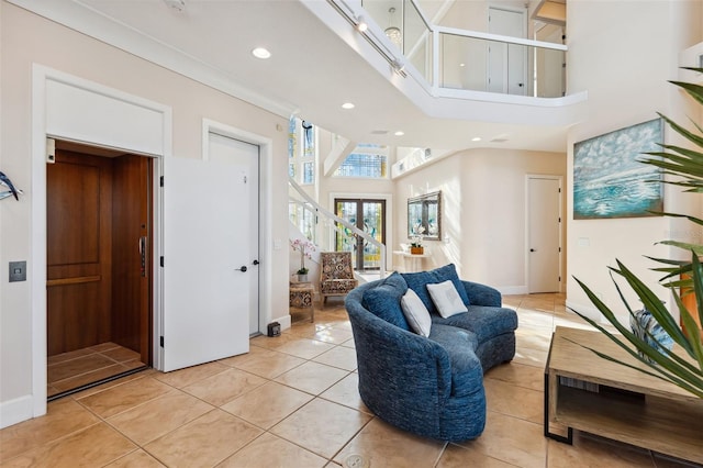 tiled living room with a towering ceiling