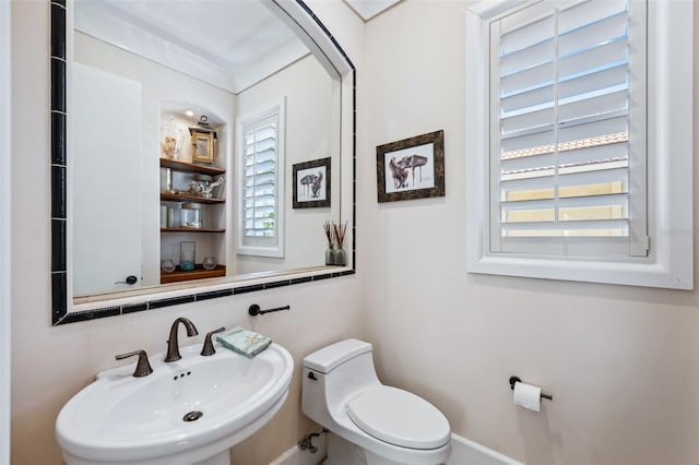 bathroom featuring sink and toilet