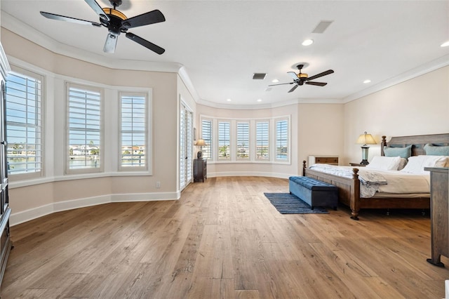 bedroom featuring light hardwood / wood-style floors and crown molding