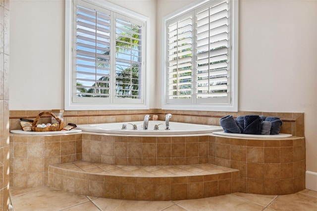 bathroom featuring tile patterned flooring and tiled tub