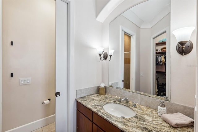 bathroom with vanity and tile patterned flooring