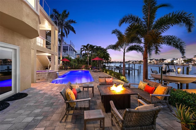 6015 Kipps Colony Dr E, Gulfport, FL 33707 - patio terrace at dusk with an outdoor fire pit, boat lift, a water view, a dock, and a patio area