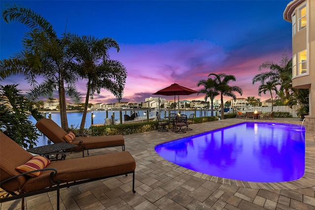 6015 Kipps Colony Dr E, Gulfport, FL 33707 - view of swimming pool featuring a water view and a patio area
