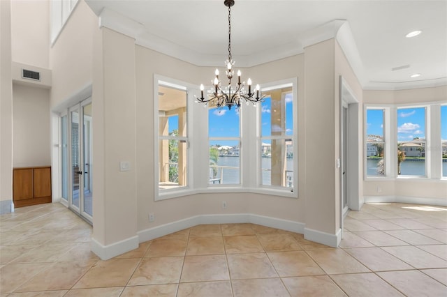 6015 Kipps Colony Dr E, Gulfport, FL 33707 - unfurnished dining area featuring a chandelier, light tile patterned flooring, a water view, and recessed lighting