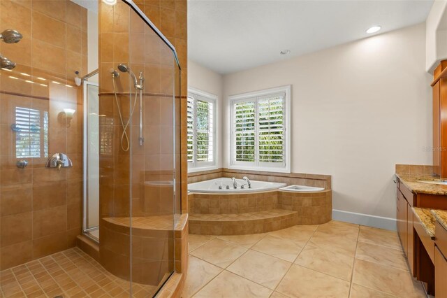 6015 Kipps Colony Dr E, Gulfport, FL 33707 - full bath with a stall shower, vanity, a bath, tile patterned floors, and recessed lighting