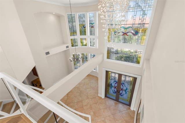 6015 Kipps Colony Dr E, Gulfport, FL 33707 - interior space featuring a chandelier, a towering ceiling, and french doors