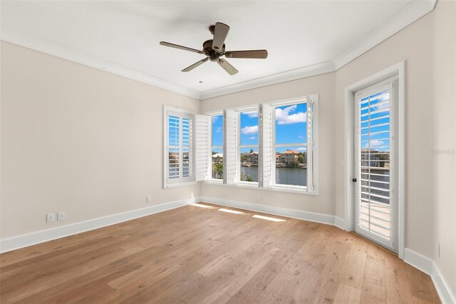 6015 Kipps Colony Dr E, Gulfport, FL 33707 - spare room featuring ornamental molding, light wood-style floors, and ceiling fan