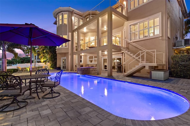 6015 Kipps Colony Dr E, Gulfport, FL 33707 - swimming pool with an outdoor hot tub, a patio area, and stairs
