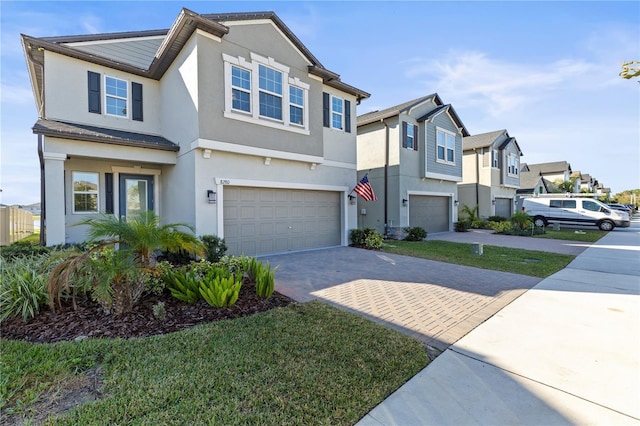 multi unit property featuring a garage