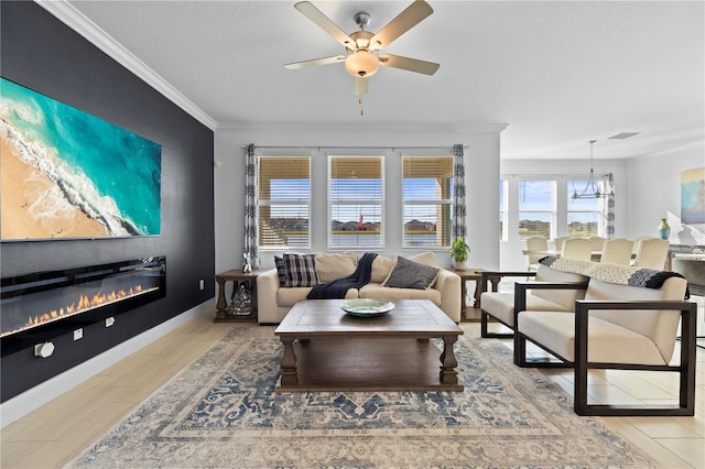 living room featuring a textured ceiling, hardwood / wood-style flooring, ceiling fan, and ornamental molding