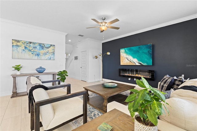 living room with ceiling fan and ornamental molding