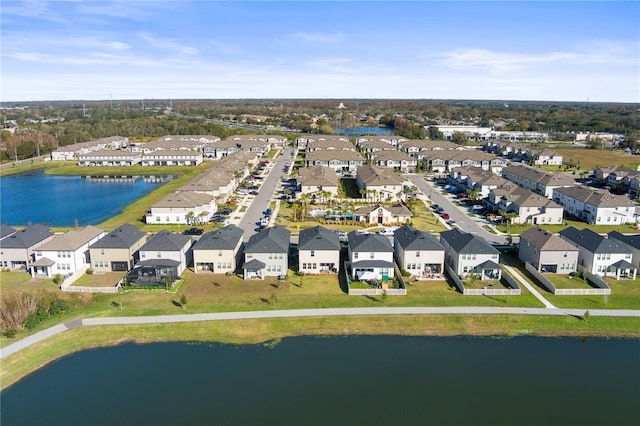 birds eye view of property with a water view