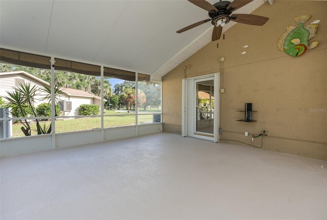 unfurnished sunroom with ceiling fan and lofted ceiling