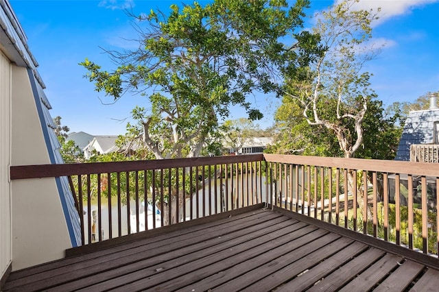 wooden deck featuring a water view