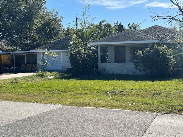 view of property exterior featuring a carport and a yard