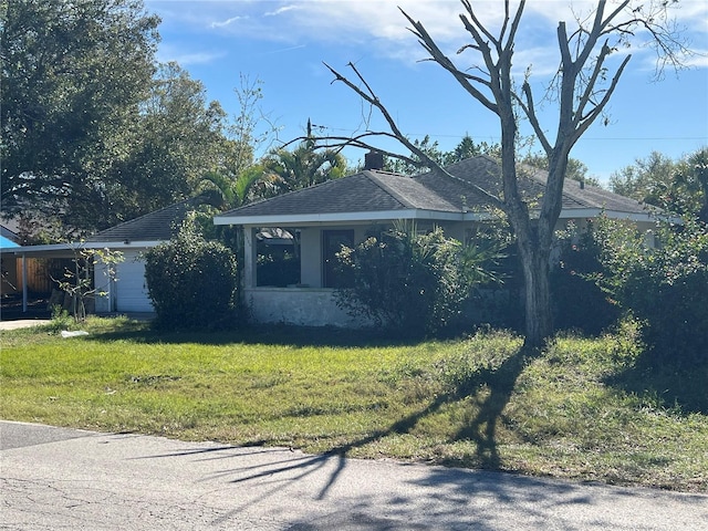 view of side of property with a yard