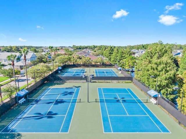 view of tennis court with fence