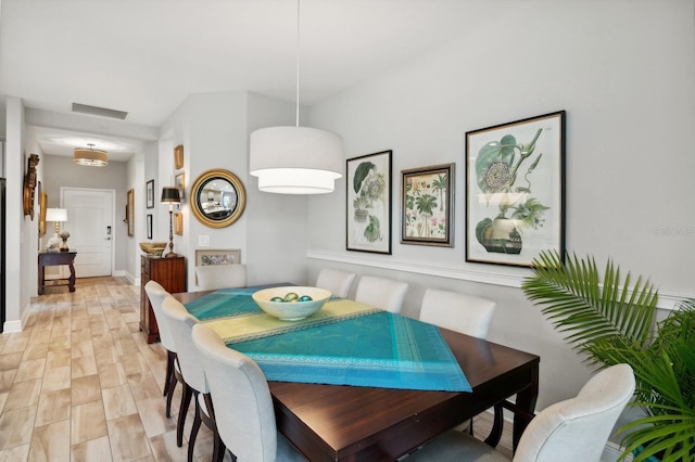 dining area with light wood-type flooring