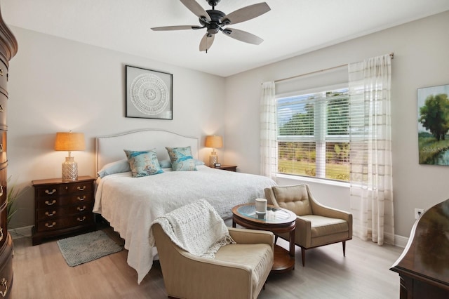 bedroom featuring ceiling fan and light hardwood / wood-style floors