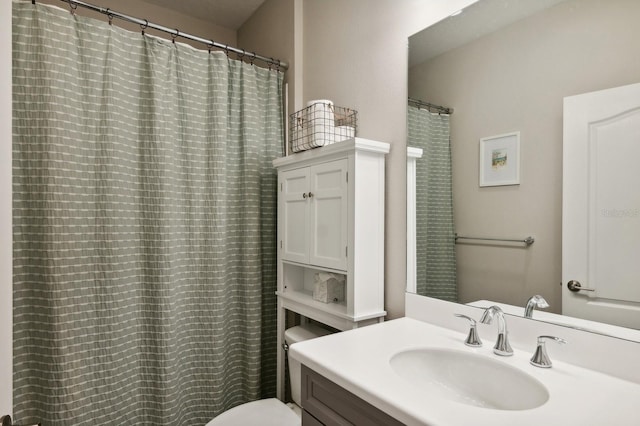 bathroom with toilet and vanity