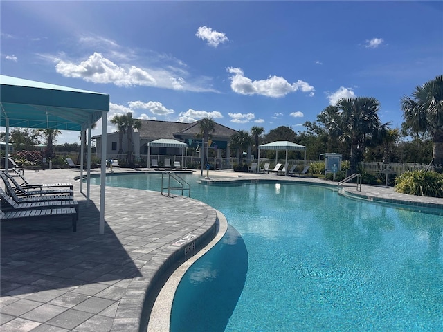 view of swimming pool featuring a patio area and a gazebo