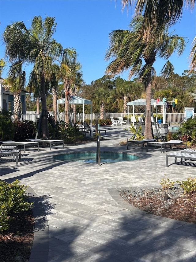 view of pool with a playground