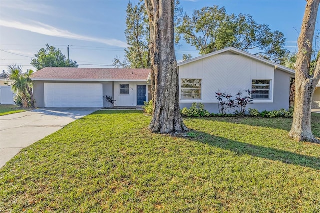 ranch-style house with a garage and a front yard