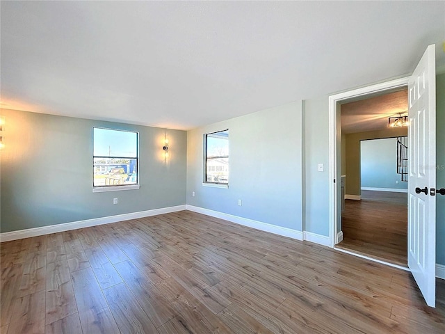 unfurnished room featuring light hardwood / wood-style floors