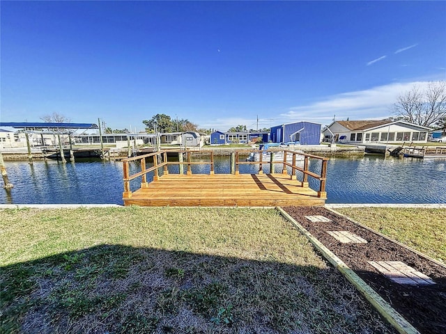 dock area featuring a water view and a yard