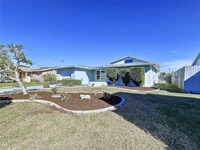 ranch-style home with a front yard