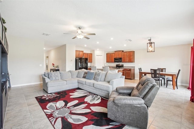 tiled living room with ceiling fan