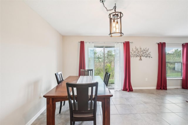 dining space featuring plenty of natural light and light tile patterned floors