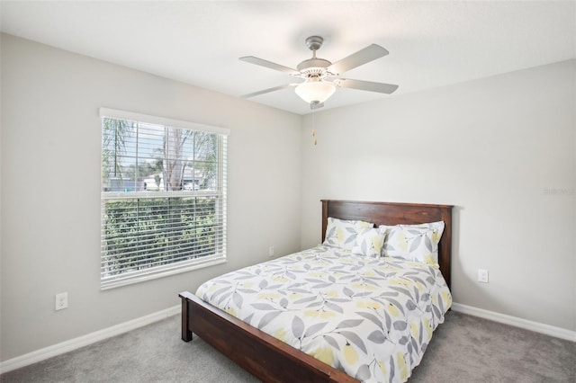 bedroom with ceiling fan and carpet flooring