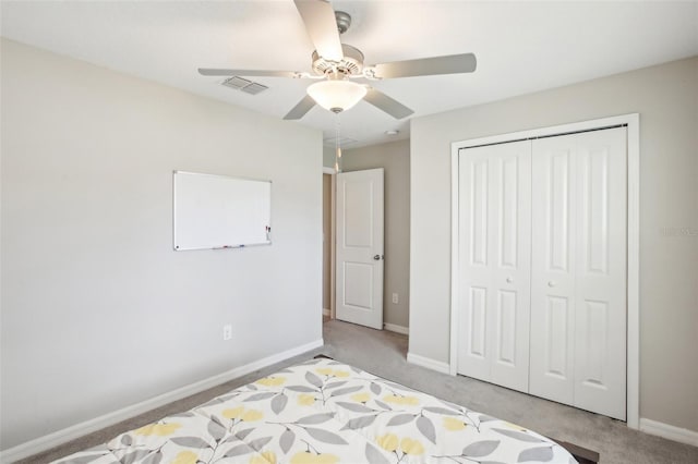 unfurnished bedroom featuring light carpet, a closet, and ceiling fan