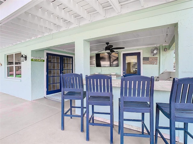 view of patio / terrace with french doors and an outdoor bar