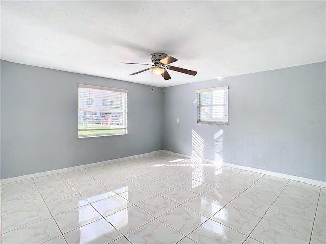 empty room featuring ceiling fan