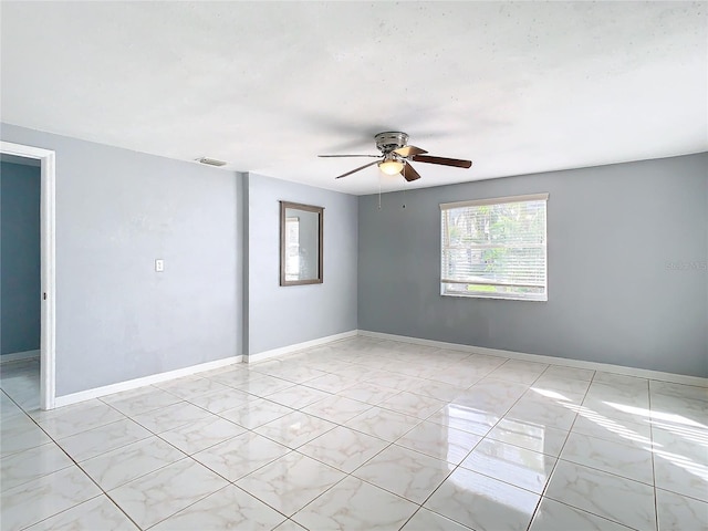 empty room featuring ceiling fan