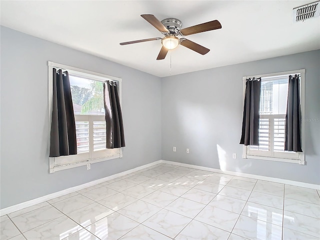 unfurnished room featuring ceiling fan