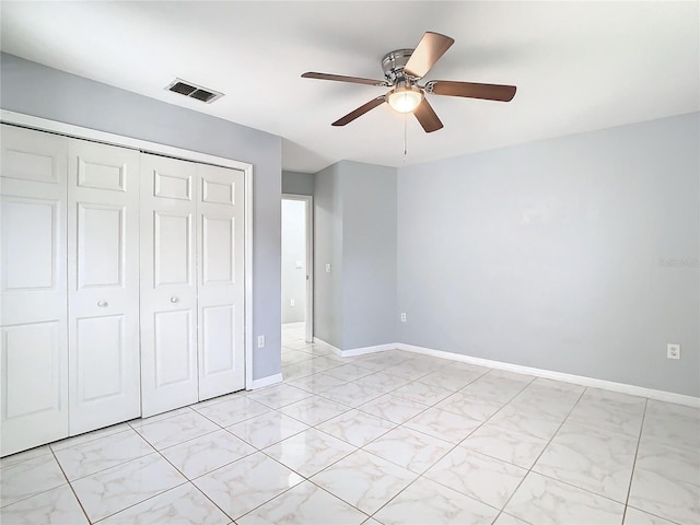 unfurnished bedroom featuring a closet and ceiling fan