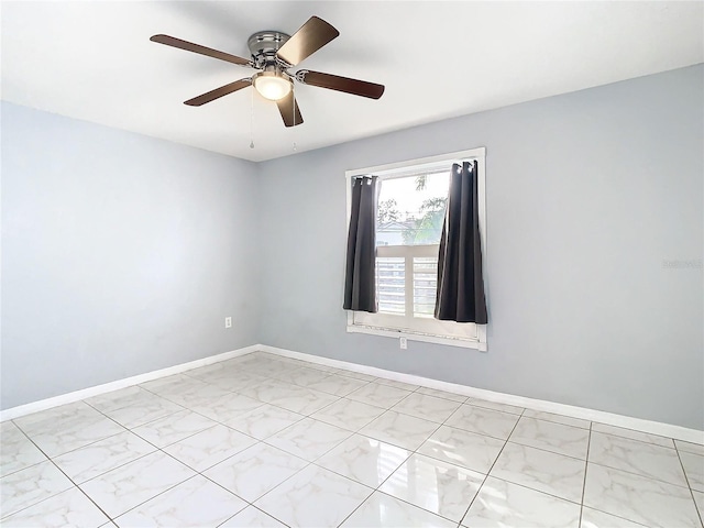 spare room featuring ceiling fan