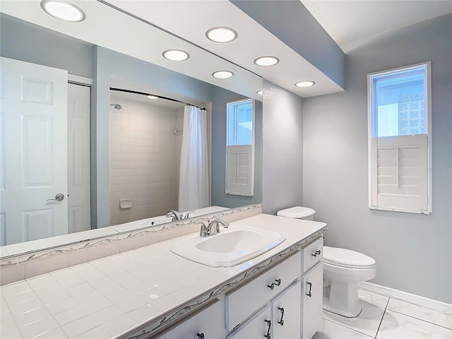 bathroom featuring tile patterned flooring, vanity, toilet, and curtained shower