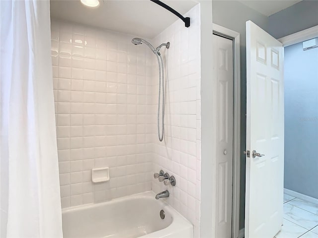 bathroom with shower / tub combo