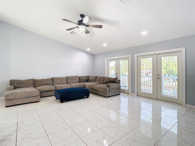 living room with french doors, light tile patterned floors, and ceiling fan