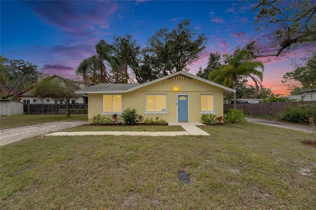 ranch-style house with a yard