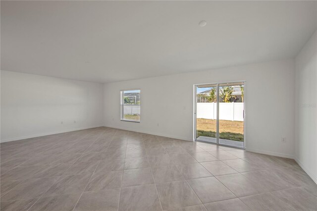 110 Lilyan Ct, Rotonda West, FL 33947 - unfurnished room featuring light tile patterned flooring and baseboards